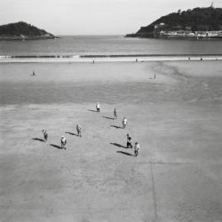 San Sebastian, Spain. men on beach.