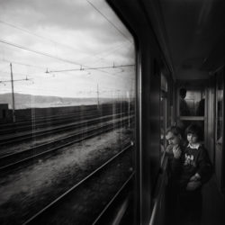 Father and daughter on train from Naples, Italy to Palermo, Sicily.